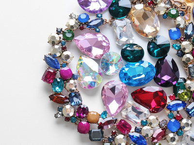 Semi-Precious Gemstones: A Comprehensive Guide to Amethyst and Topaz Jewelry